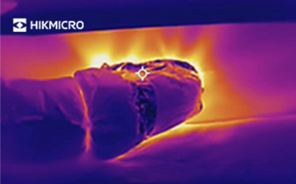 Thermal image of an insulated air duct leaking warm air at a joint